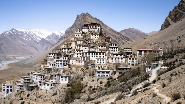 A scenic view of the Key Monastery located in the Himalayan mountains with a stunning landscape background.