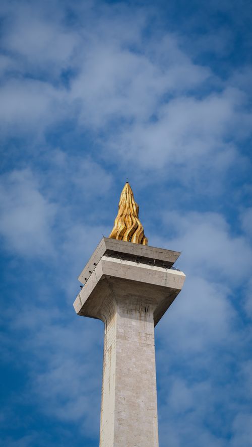 Free The iconic Monas National Monument in Jakarta, Indonesia with a clear blue sky background. Stock Photo