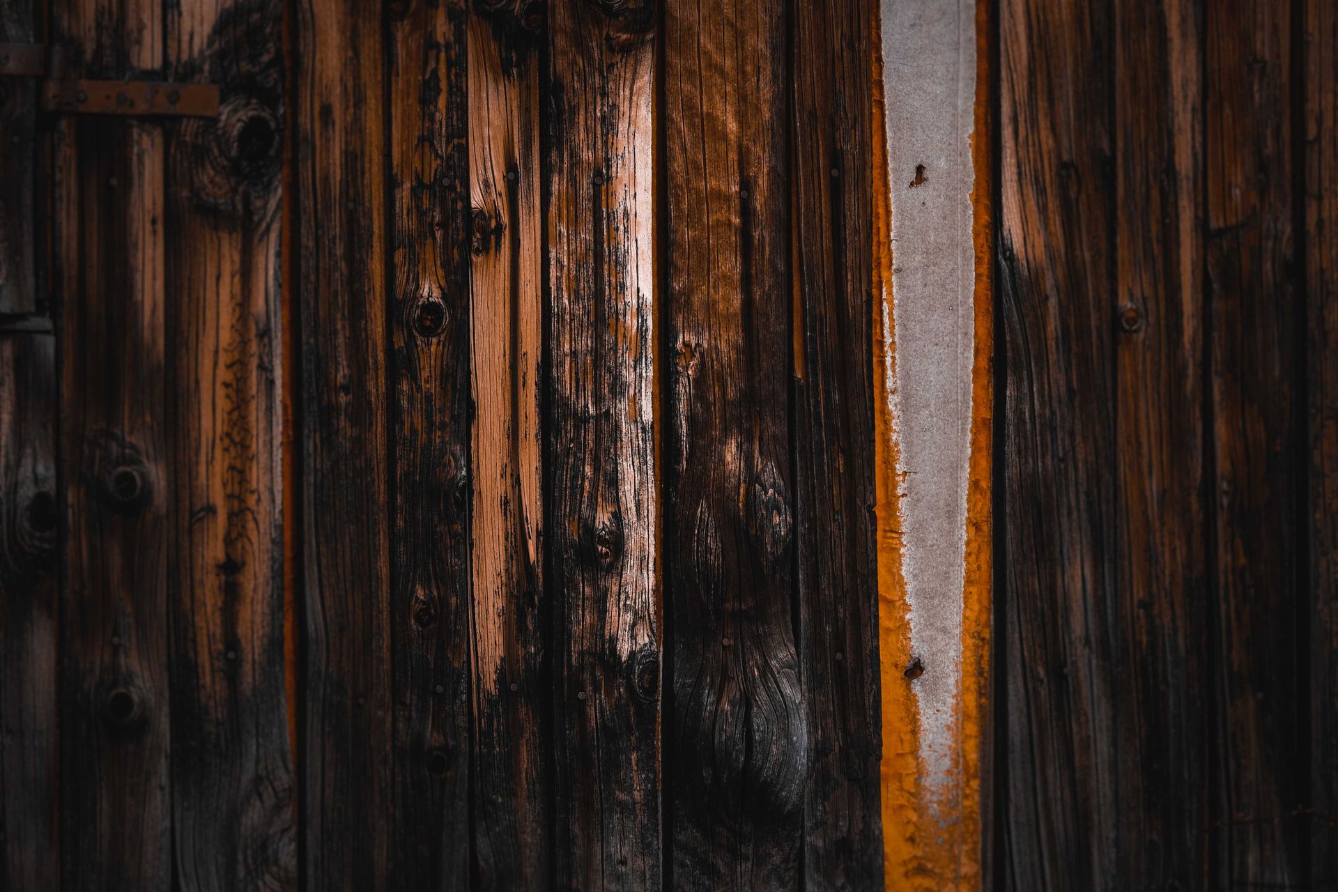 Aged textured background with shabby surface made of wooden planks and metal element