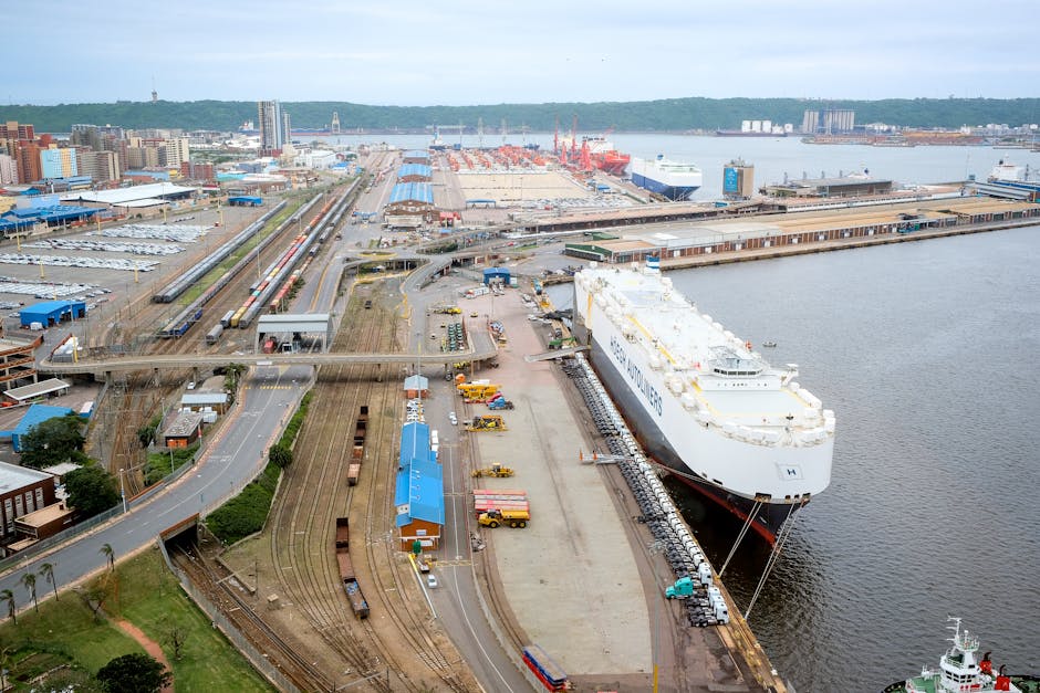 Aerial shot of Durban harbor capturing docked ship and surrounding infrastructure.