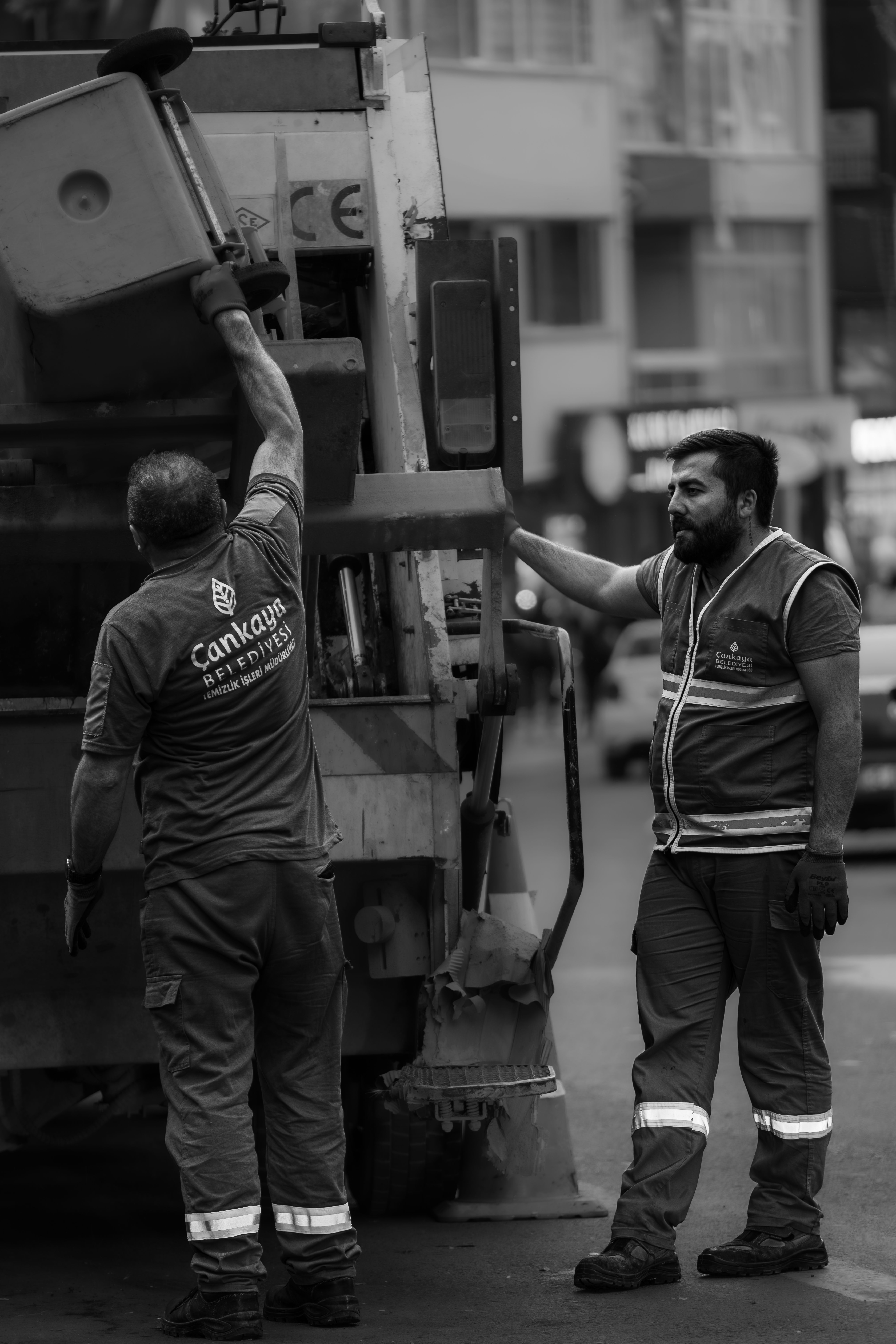 Sanitation workers in Ankara loading a garbage truck, showcasing teamwork and community service.
