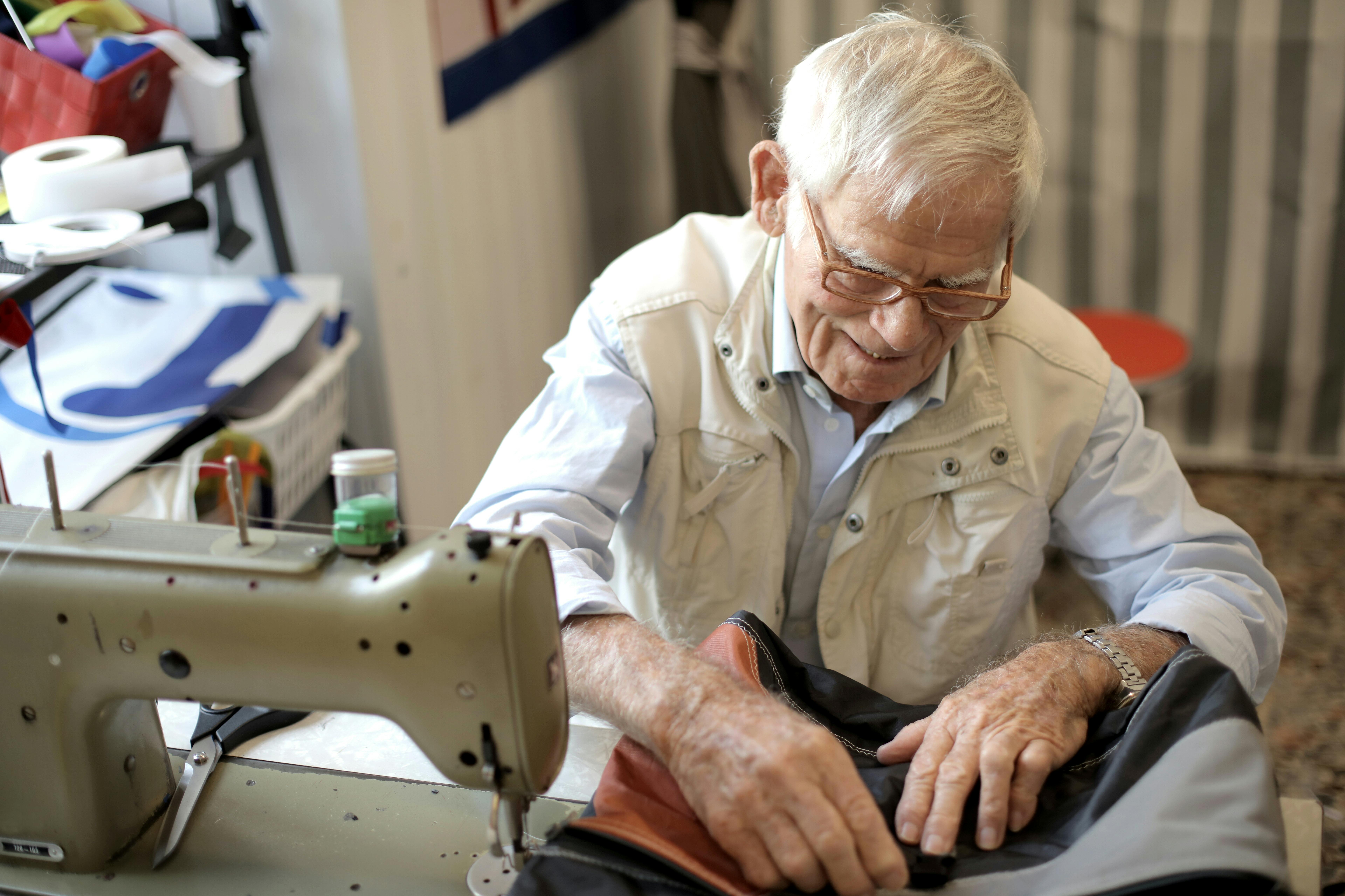 photo of man sewing