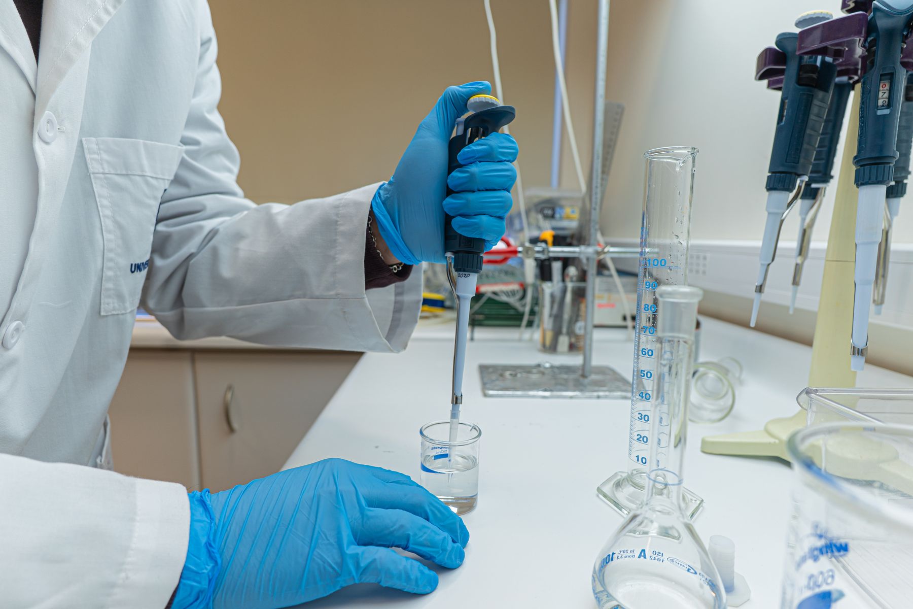 Scientist using precision laboratory equipment