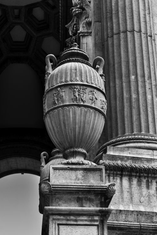 Free Black and white image of an ornate stone urn at a historic architecture site. Stock Photo