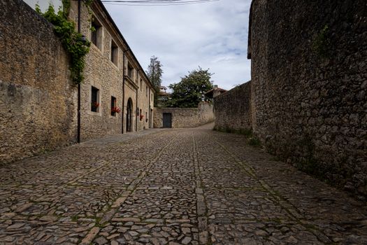 Stone buildings and cobblestone street in Santillana del Mar, Cantabria.