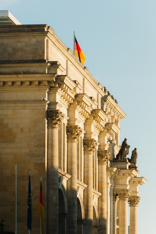 Free The iconic Reichstag building facade illuminated by sunlight in Berlin, Germany. Stock Photo