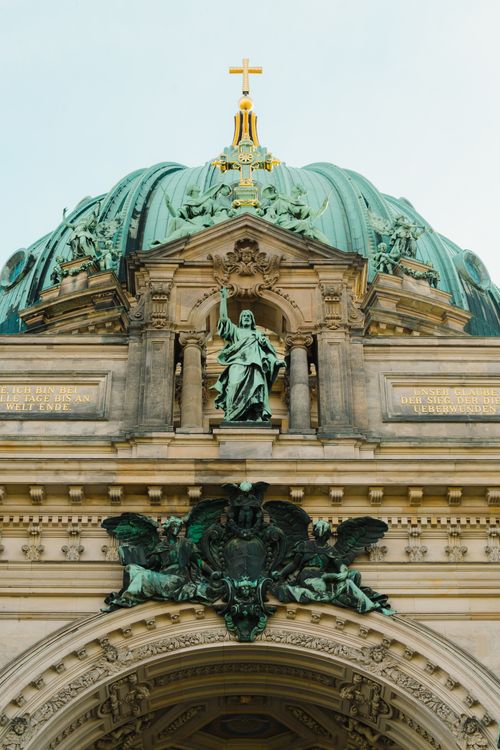 Free Close-up view of the ornate Berlin Cathedral dome showcasing detailed sculptures and architectural elements. Stock Photo