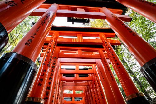 Free Explore the iconic red torii gates of Fushimi Inari Shrine in Kyoto, Japan, offering a mesmerizing view. Stock Photo