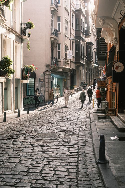 Free Explore a picturesque cobblestone street in Istanbul, showcasing urban architecture and daily life. Stock Photo