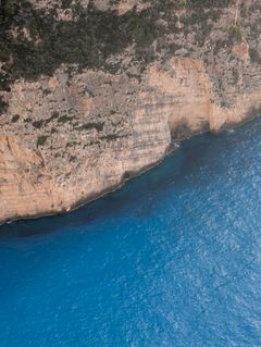 Sea cliffs above a coastline — photo by sn3k on Pexels