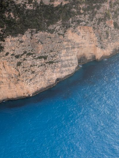 Sea cliffs above a coastline — photo by sn3k on Pexels