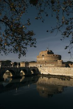 Capture of Castel Sant'Angelo and Ponte Sant'Angelo reflecting in the Tiber River in Rome, Italy.