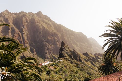 Free Magnificent landscape of Masca village in Tenerife, Spain, with rugged mountains and palm trees. Stock Photo