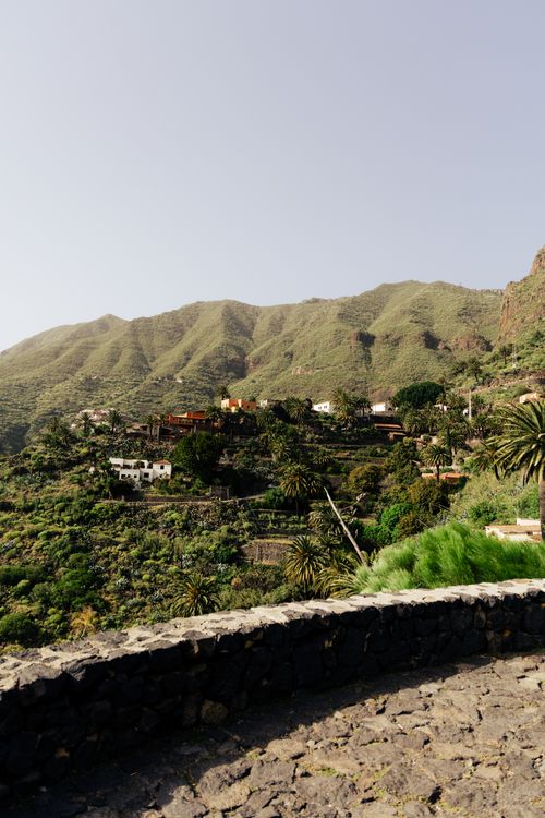 Free Panoramic view of the picturesque Masca village surrounded by lush green mountains in Tenerife, Spain. Stock Photo