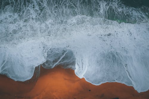 Aerial View Photo of Waves on Seashore