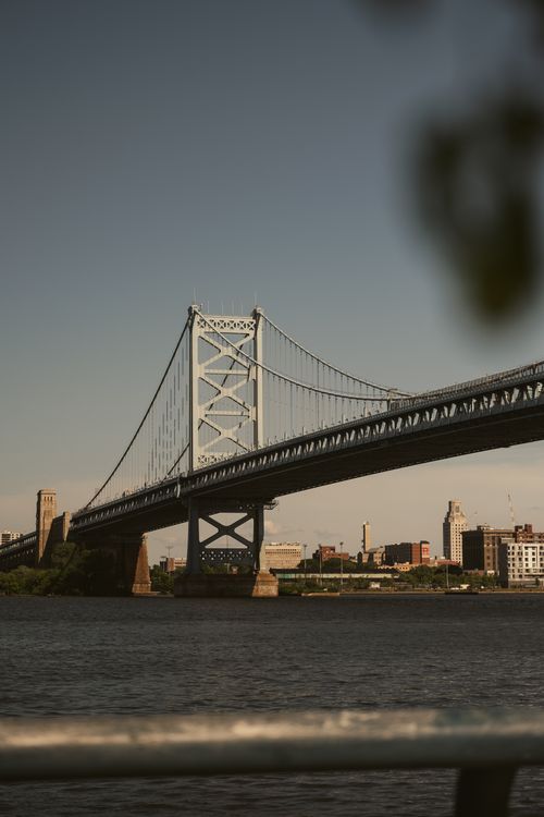 Free A scenic view of the Benjamin Franklin Bridge over the Delaware River in Philadelphia. Stock Photo