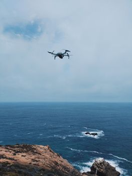 Captivating drone flight over the rugged coastline of Herolds Bay, Western Cape, South Africa.
