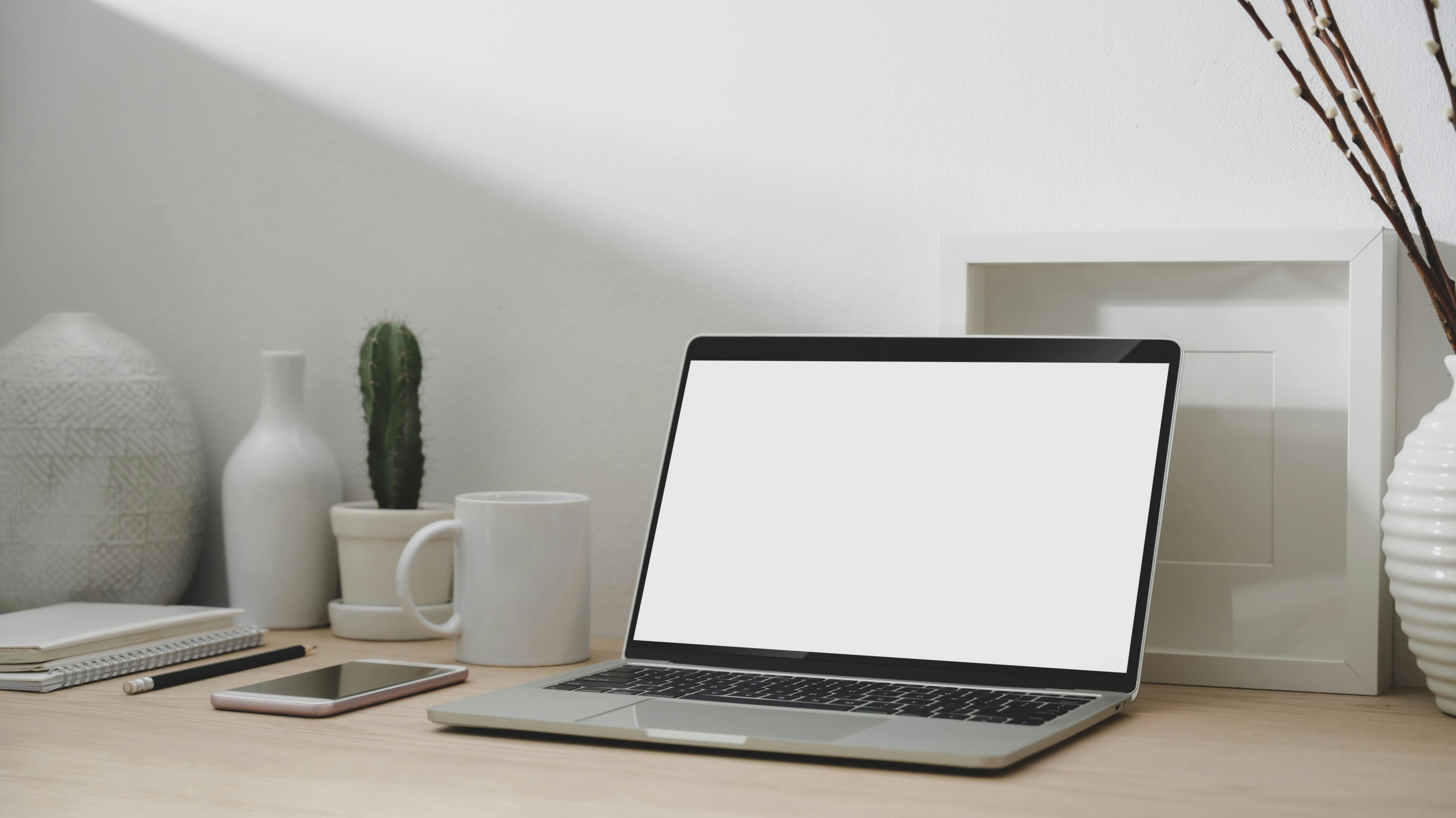 Macbook Air on Grey Wooden Table · Free Stock Photo