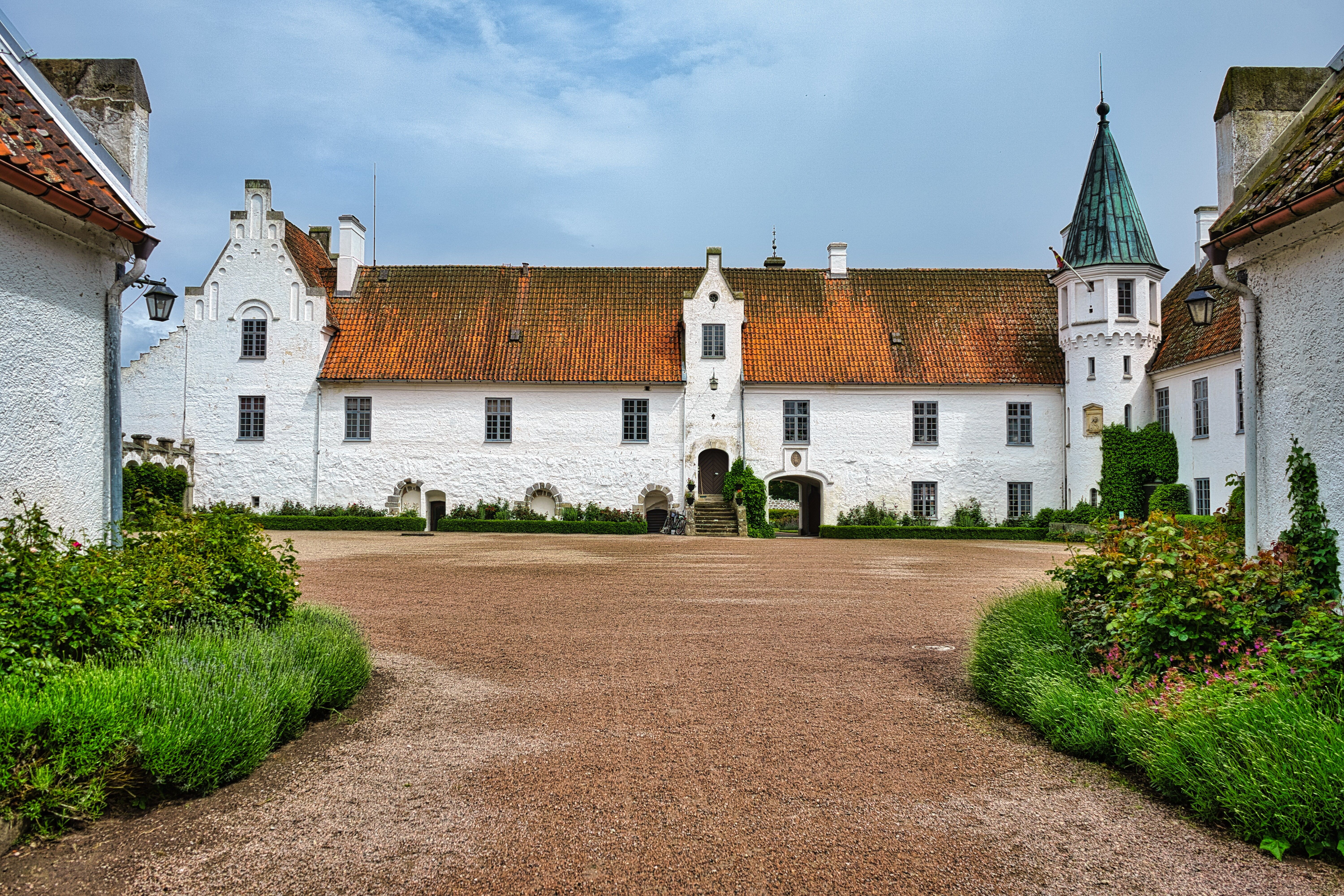 Discover the charming medieval Bosjökloster Abbey with its classic architecture in scenic Skåne, Sweden.