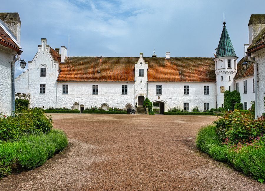 Discover the charming medieval Bosjökloster Abbey with its classic architecture in scenic Skåne, Sweden.
