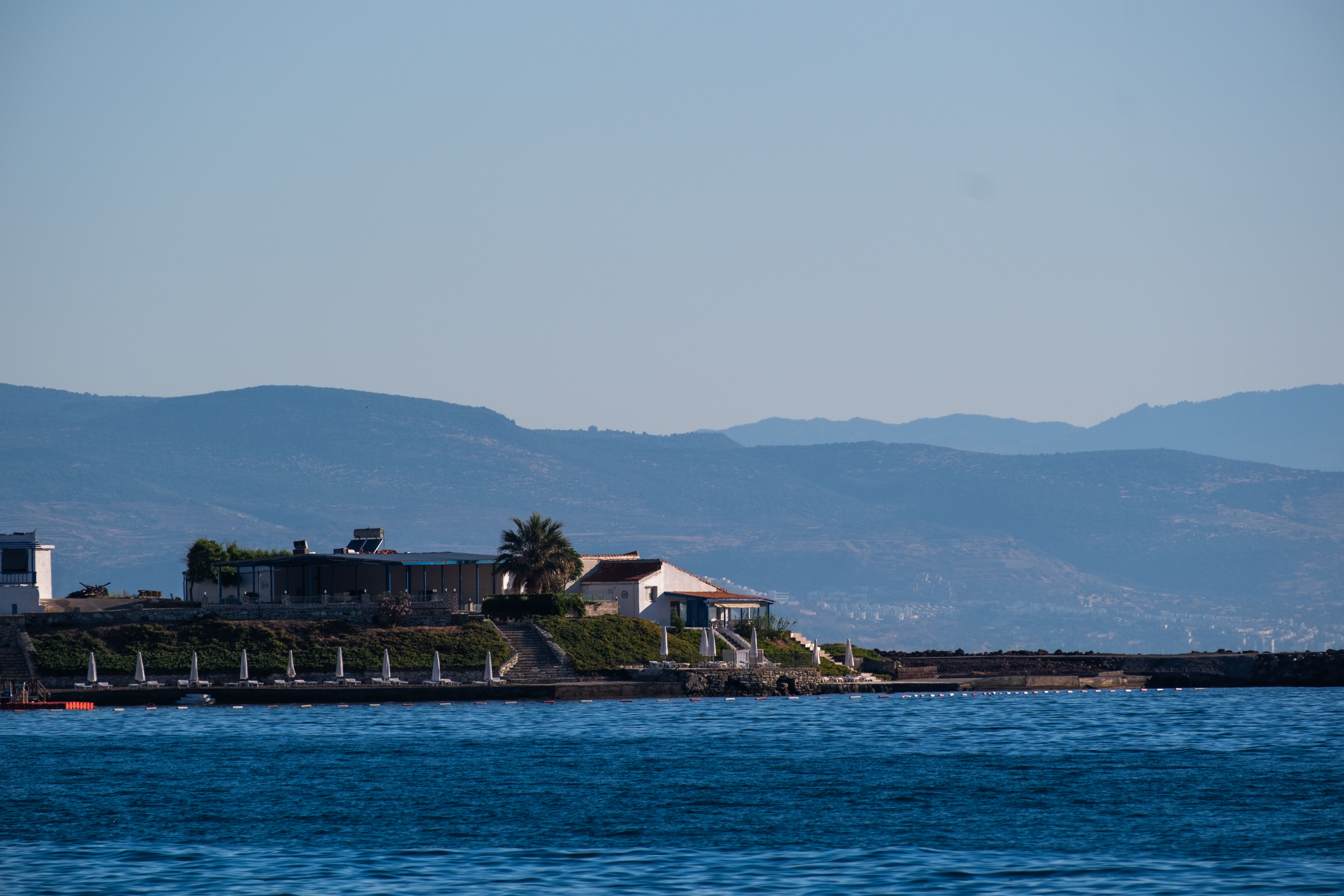 Stunning seascape of Foça, İzmir with coastal houses and mountains in the background. - Photo by Doğan Alpaslan  Demir on Pexels