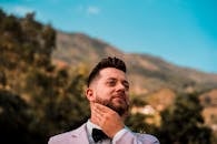 Man Holding His Beard