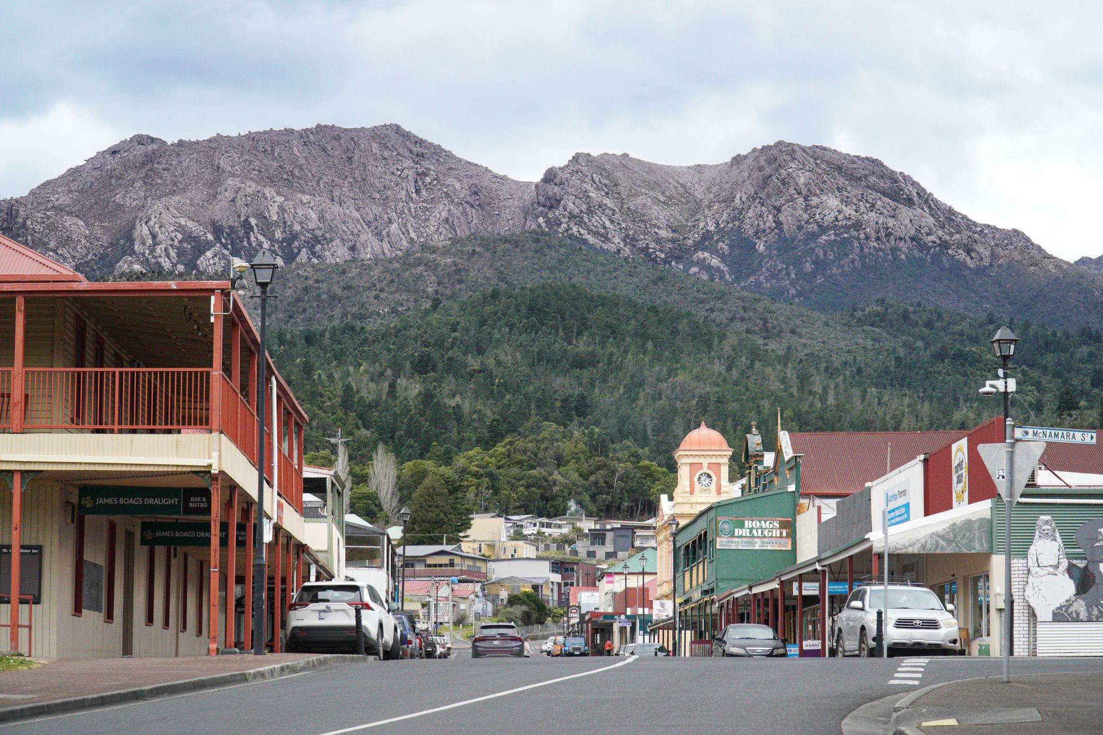 Charming main street view in Queenstown, TAS, with rugged mountains in the background