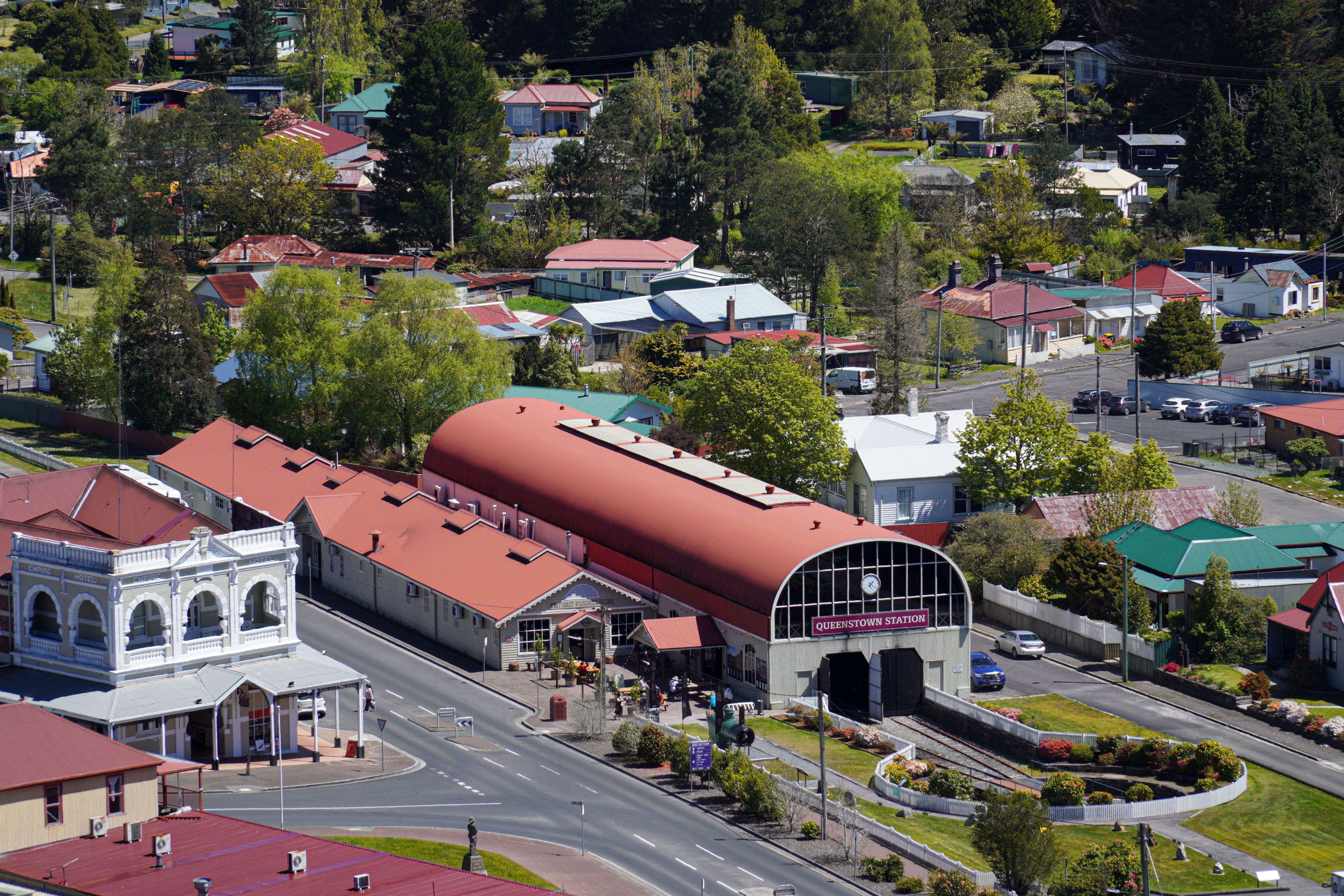 Amazing Half-Day Milford Helicopter Flight and Cruise from Queenstown Review Review 2026 - Scenic aerial view of Queenstown Station in Tasmania, Australia with residential homes.