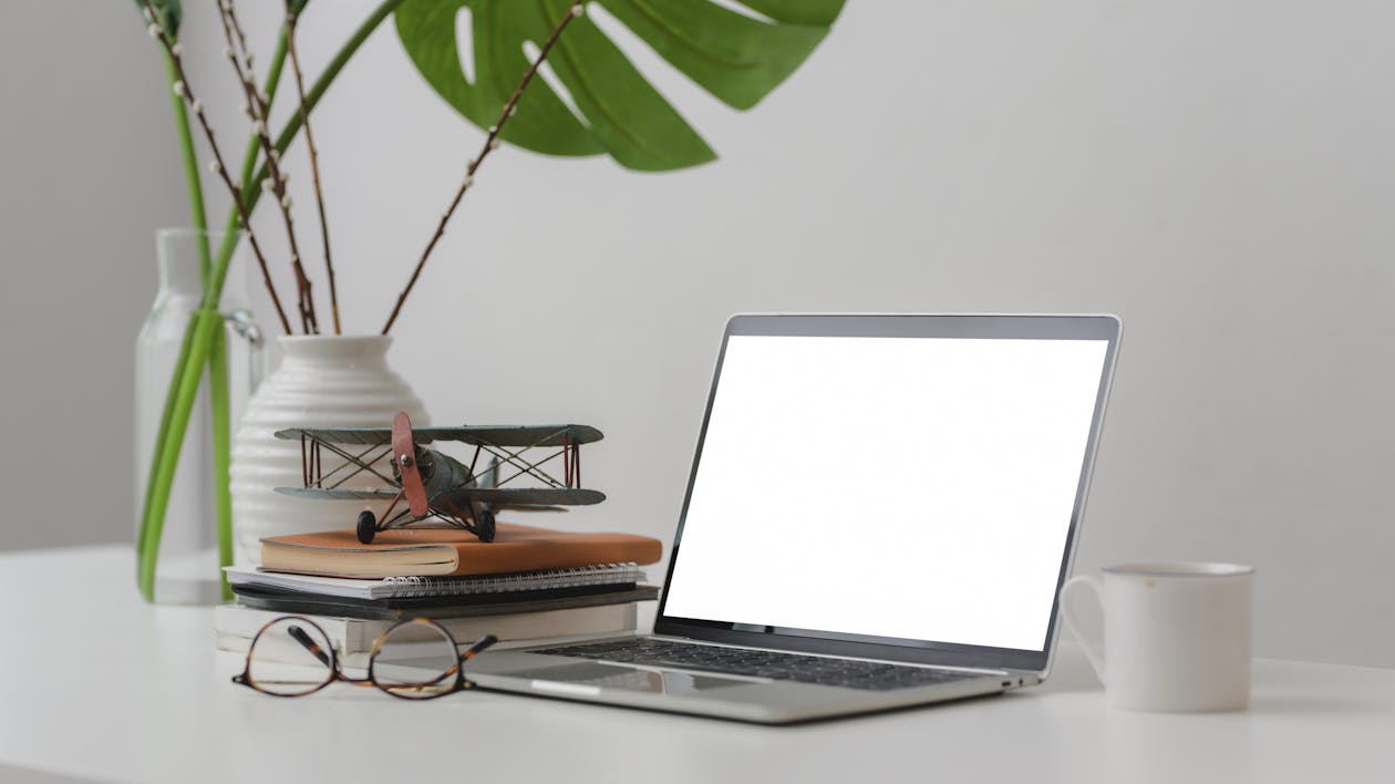 Macbook Pro on White Table