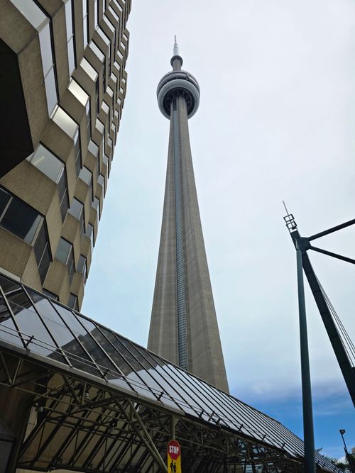 Free View of the iconic CN Tower in downtown Toronto, showcasing urban architecture. Stock Photo