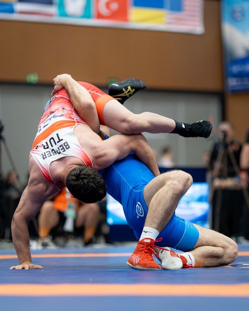 Free Intense wrestling match captured mid-action in an indoor arena, showcasing sport's athleticism. Stock Photo