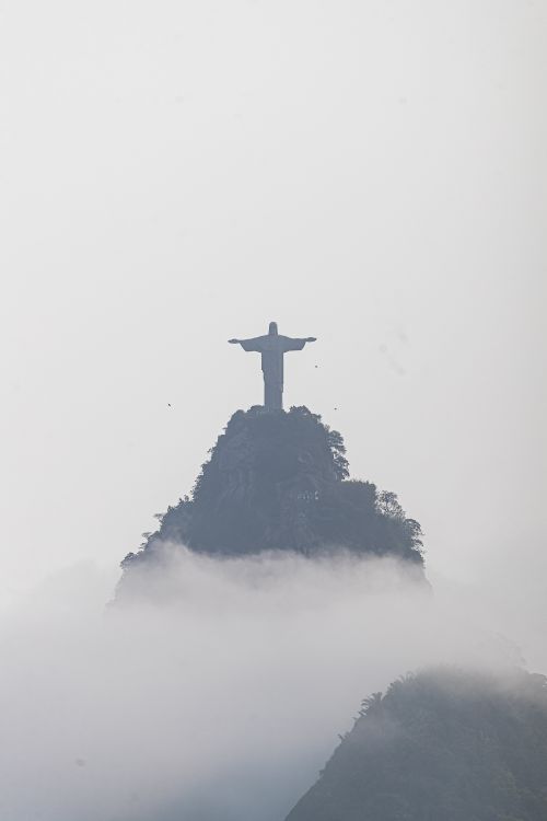 Free Iconic Christ the Redeemer in misty clouds, Rio de Janeiro. Stock Photo