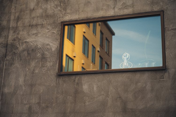 Photo Of Modern Building Facade On Shabby Gray Concrete Wall