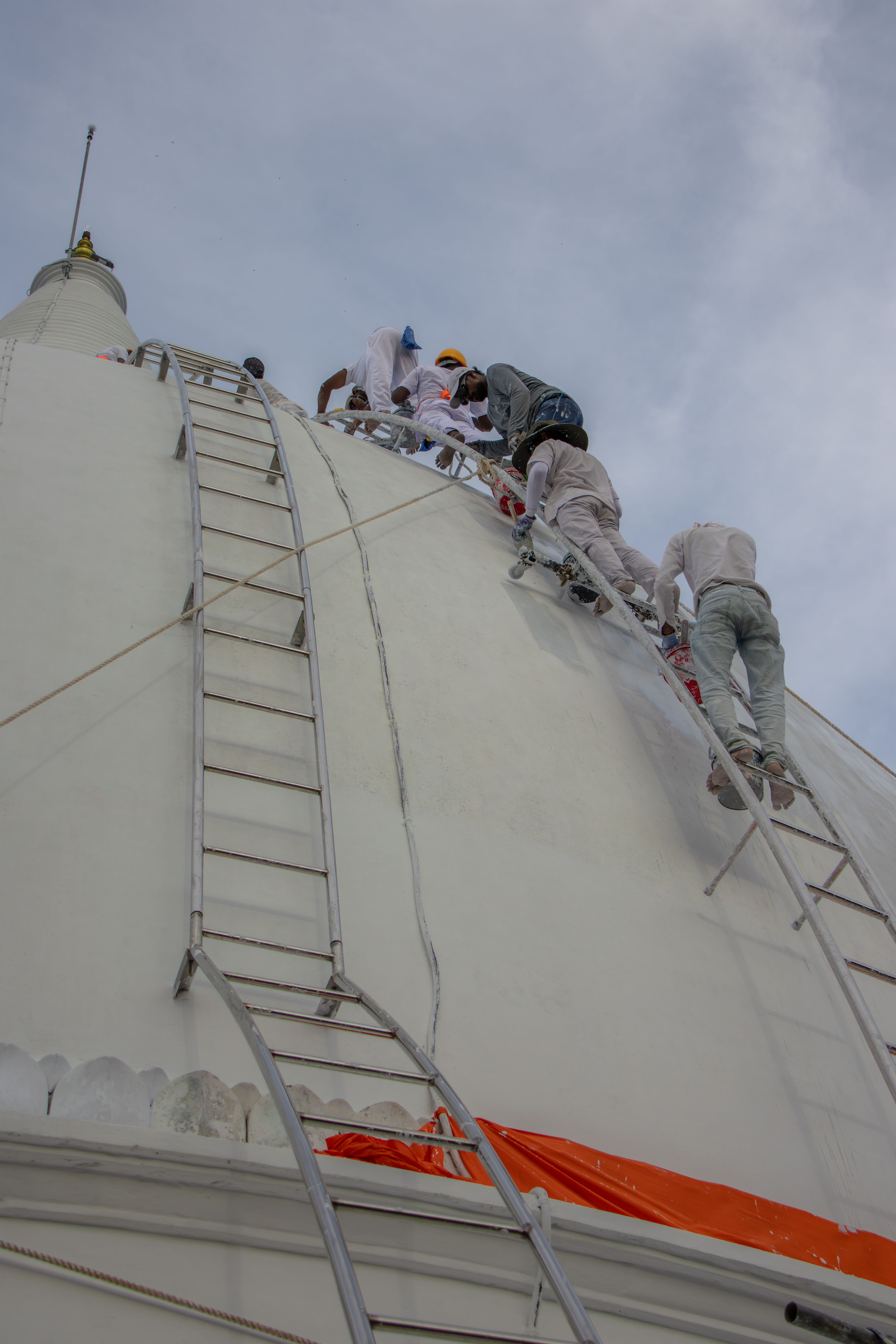 Sri Lankan construction workers on scaffolding at a building site