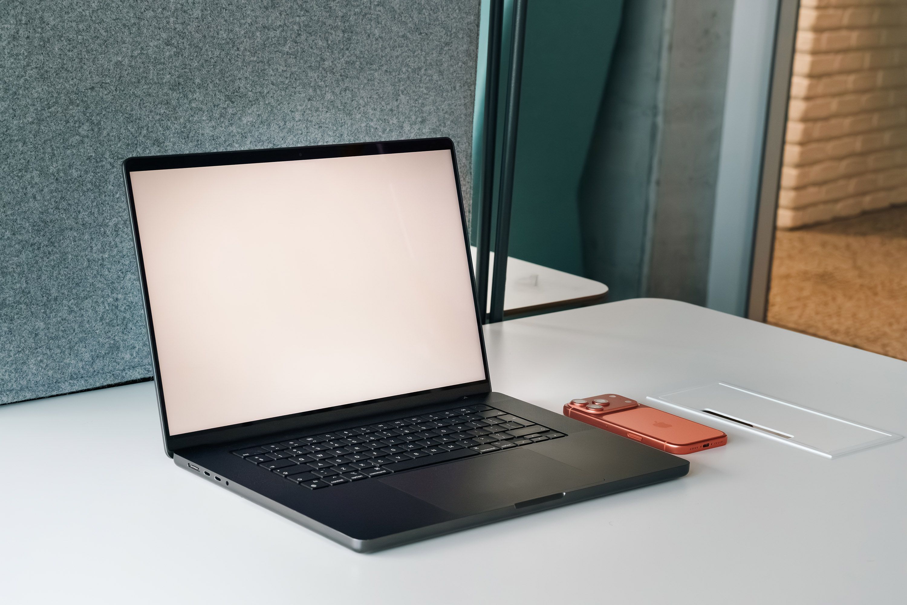 Office workspace with notebooks and devices