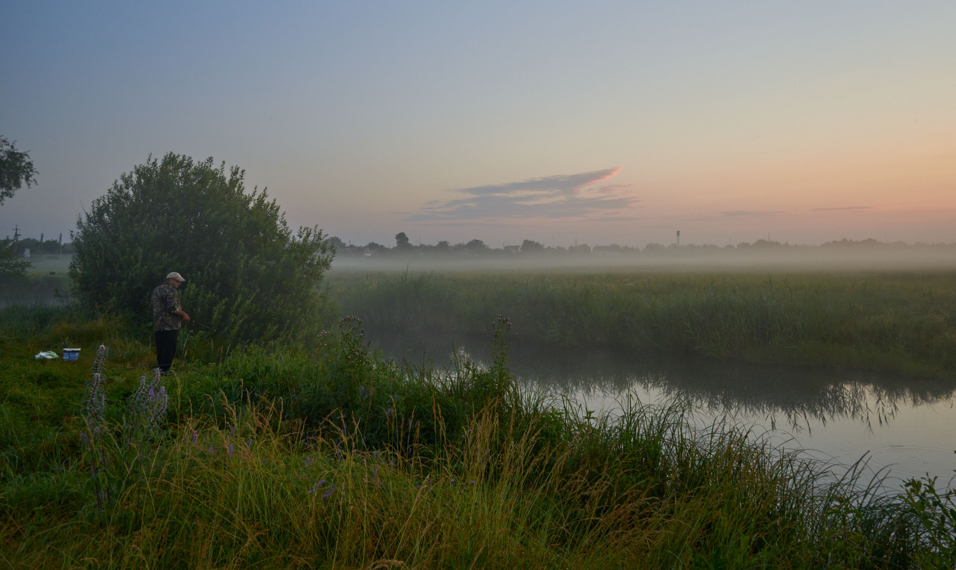 Angler at dawn on the River Severn