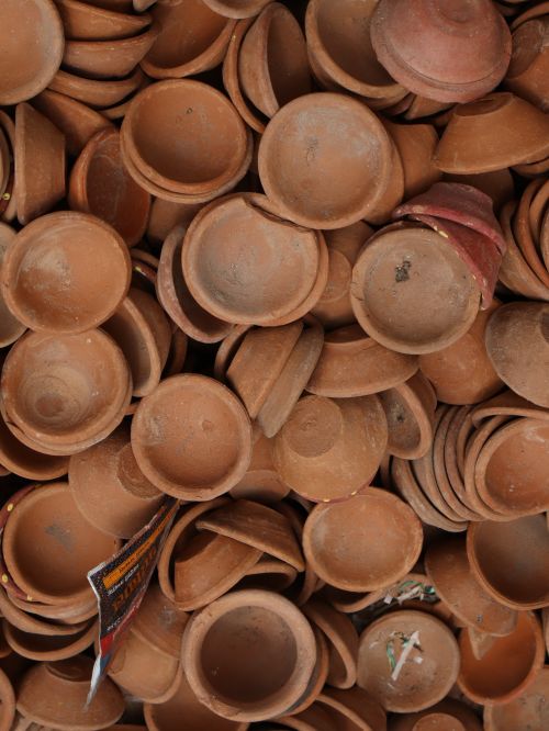 Free A variety of rustic clay pots stacked together, showcasing earthy textures and tones. Stock Photo