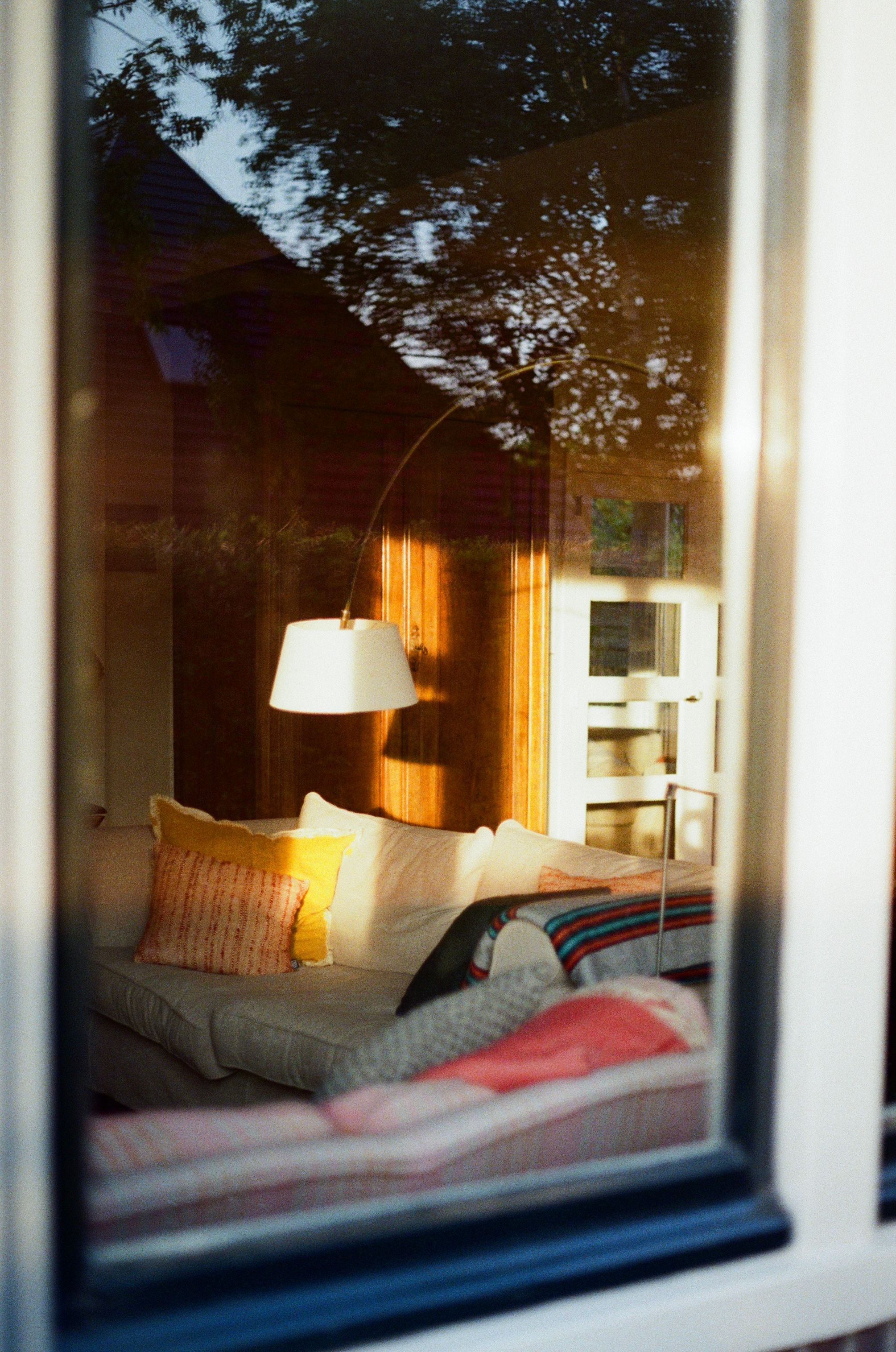 Warm and inviting interior of a living room with evening light creating a cozy atmosphere.
