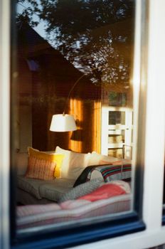 Warm and inviting interior of a living room with evening light creating a cozy atmosphere.
