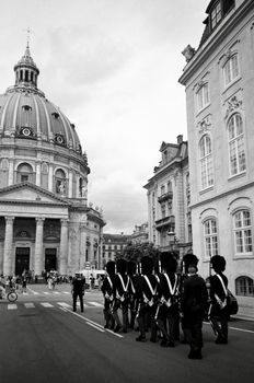 Royal Guards marching in front of the majestic Frederiks Church in Copenhagen.