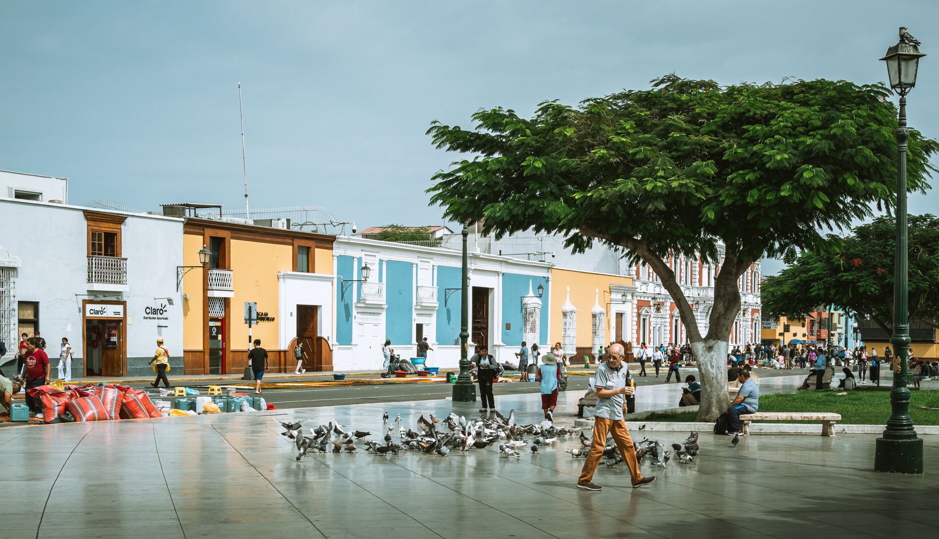 A vibrant street scene in Trujillo, capturing local architecture and daily life in Peru.