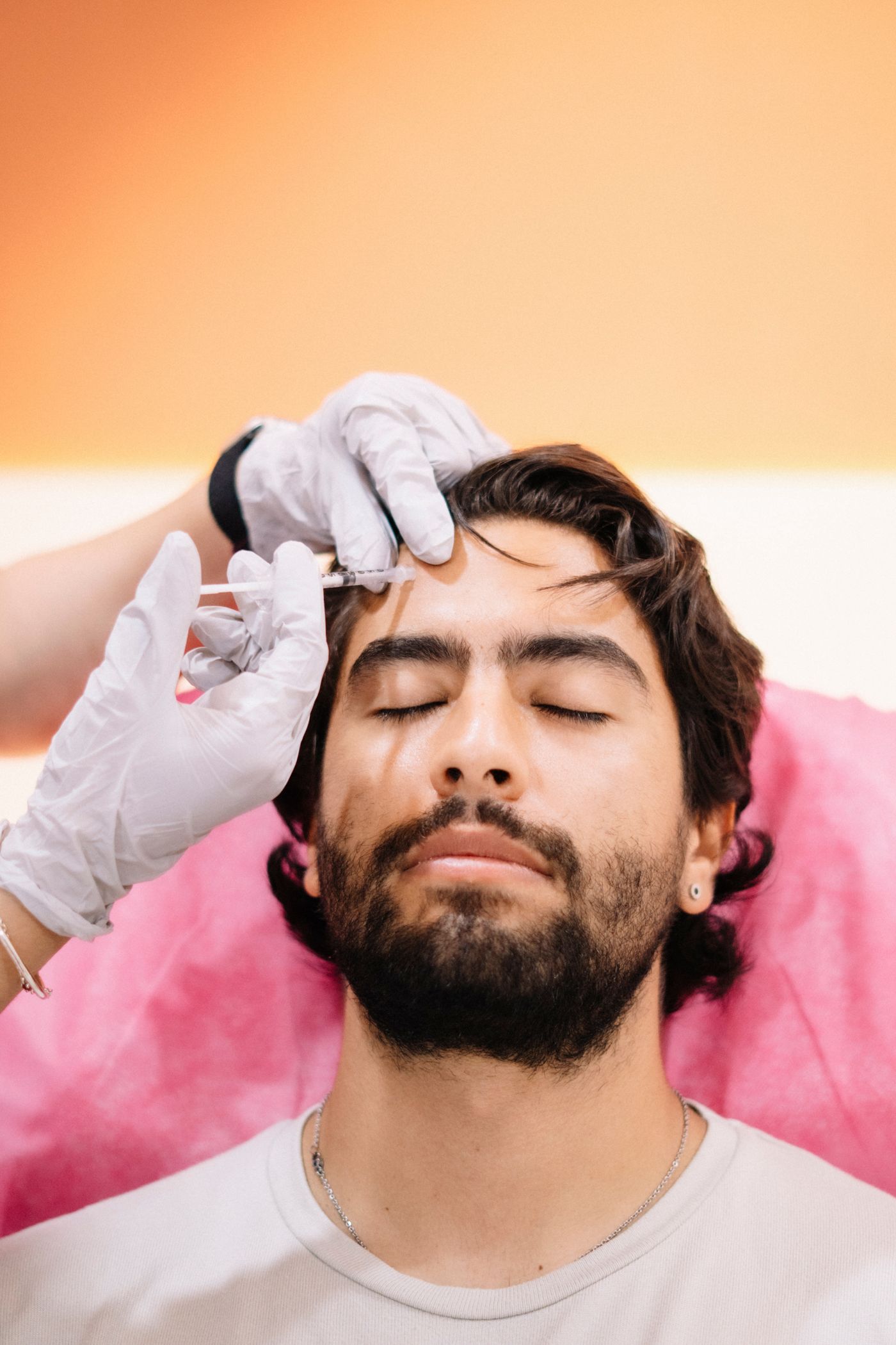 Man receiving a physician-administered treatment