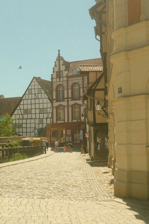 Free Charming cobblestone street with historic timber-framed houses in Quedlinburg, Germany. Stock Photo