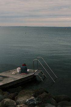 Capturing the serene solitude on a dock in Hellerup, Denmark.
