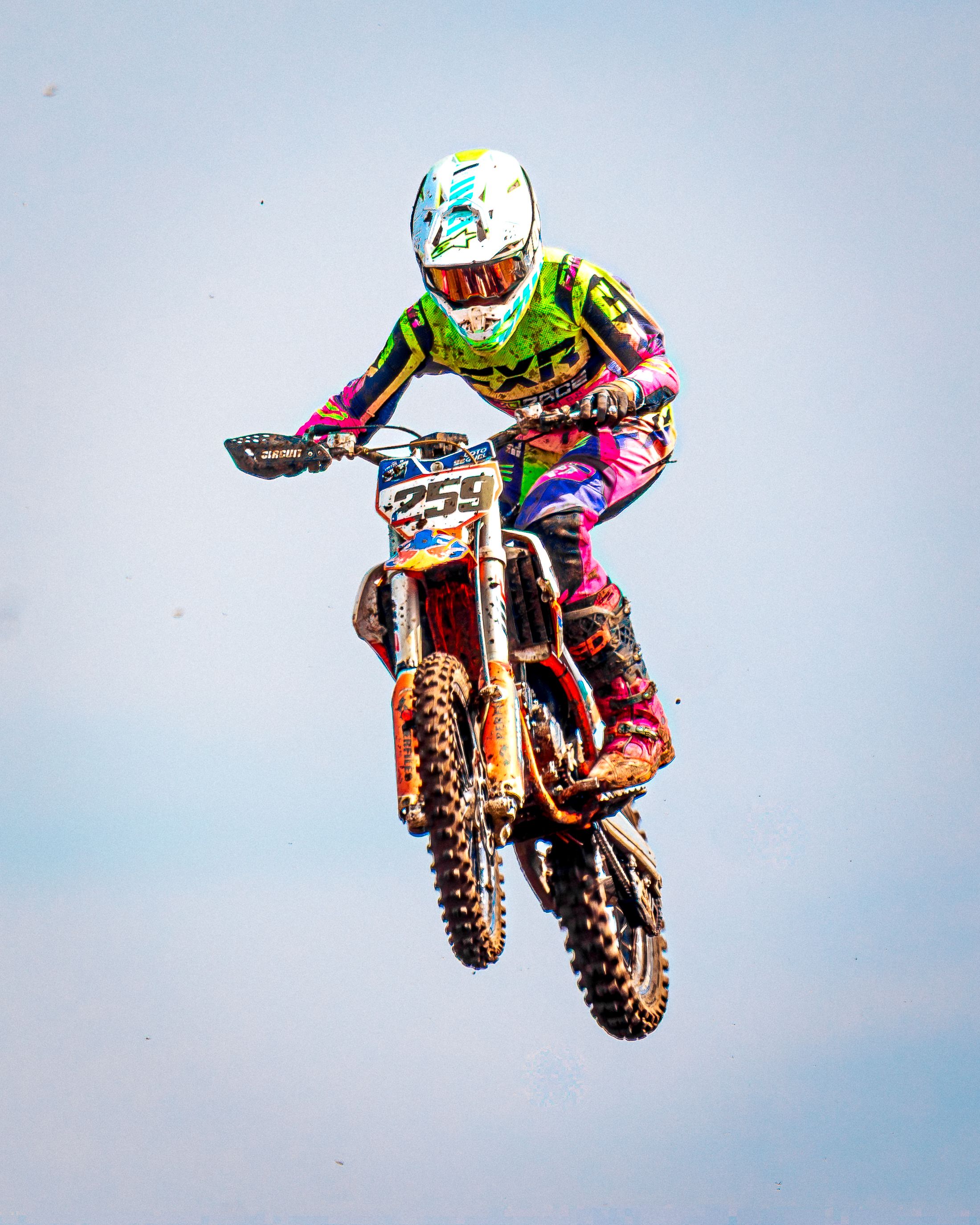 A motocross rider performing an aerial jump, showcasing skill and adrenaline in Teno, Chile.