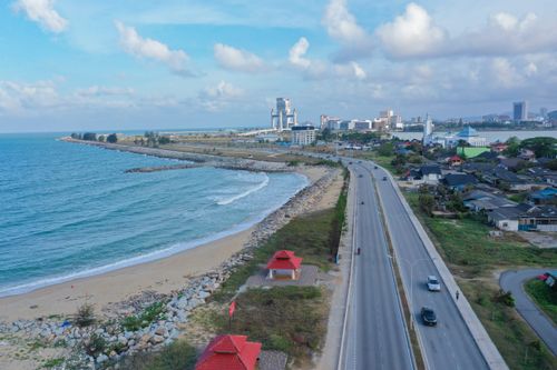 Free Aerial photograph capturing the beautiful coastline of Terengganu, Malaysia with city skyline in the distance. Stock Photo