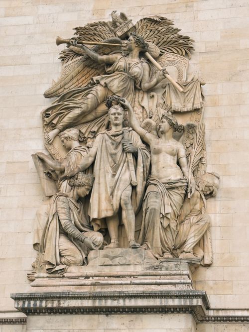 Free Intricate stone sculpture on Arc de Triomphe depicting historical figures in Paris, France. Stock Photo