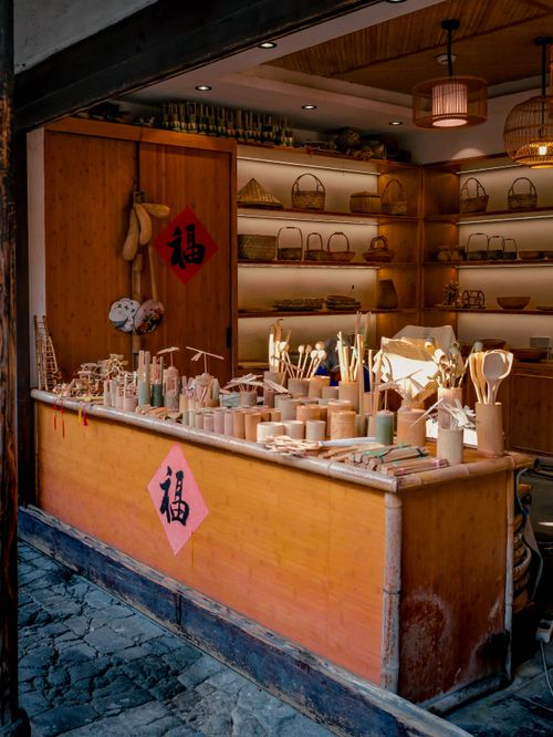 Free Cozy shop displaying bamboo crafts and baskets with traditional Chinese decor. Stock Photo