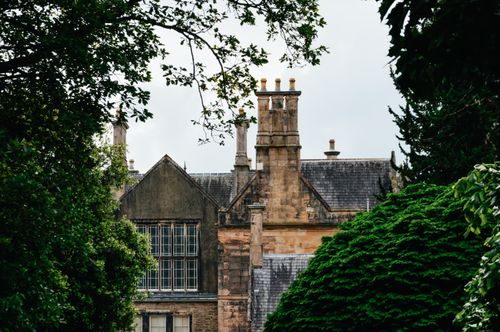 Free Charming Gothic-style architecture amid lush greenery in Killarney National Park, Ireland. Stock Photo