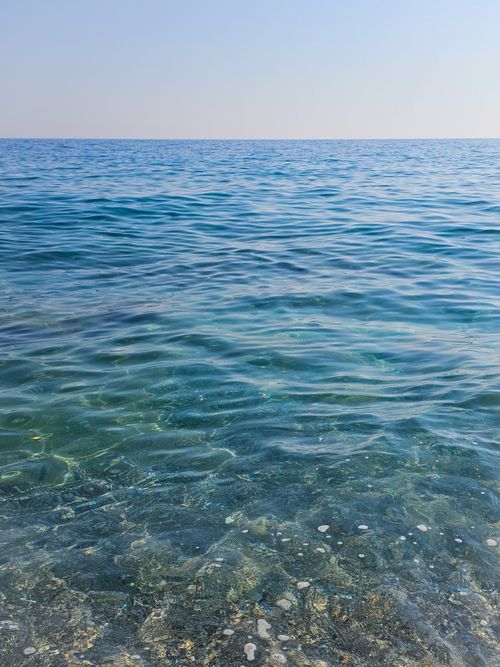 Free Tranquil scene of clear blue sea and calm horizon under a bright sky. Stock Photo